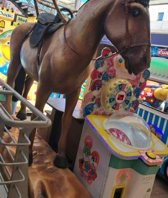 brown-mechanical-horse-kiddie