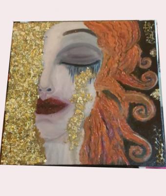 viso-di-donna-con-oro